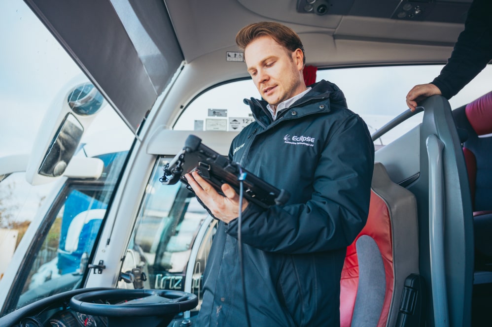 Man receiving a demo of Jaltest vehicle diagnostic equipment